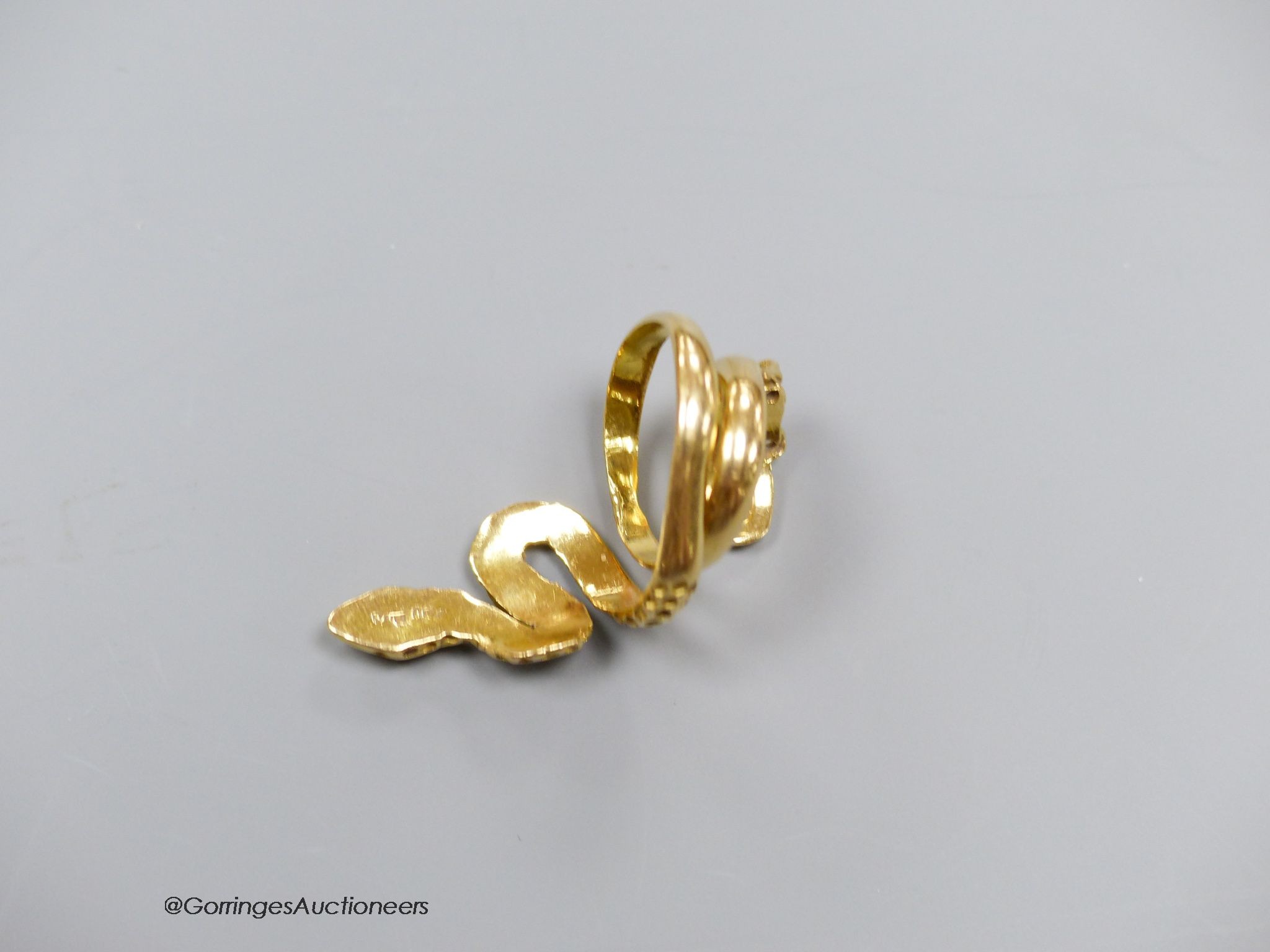 An 18ct gold (750) serpent ring, size F, 8.1g.
